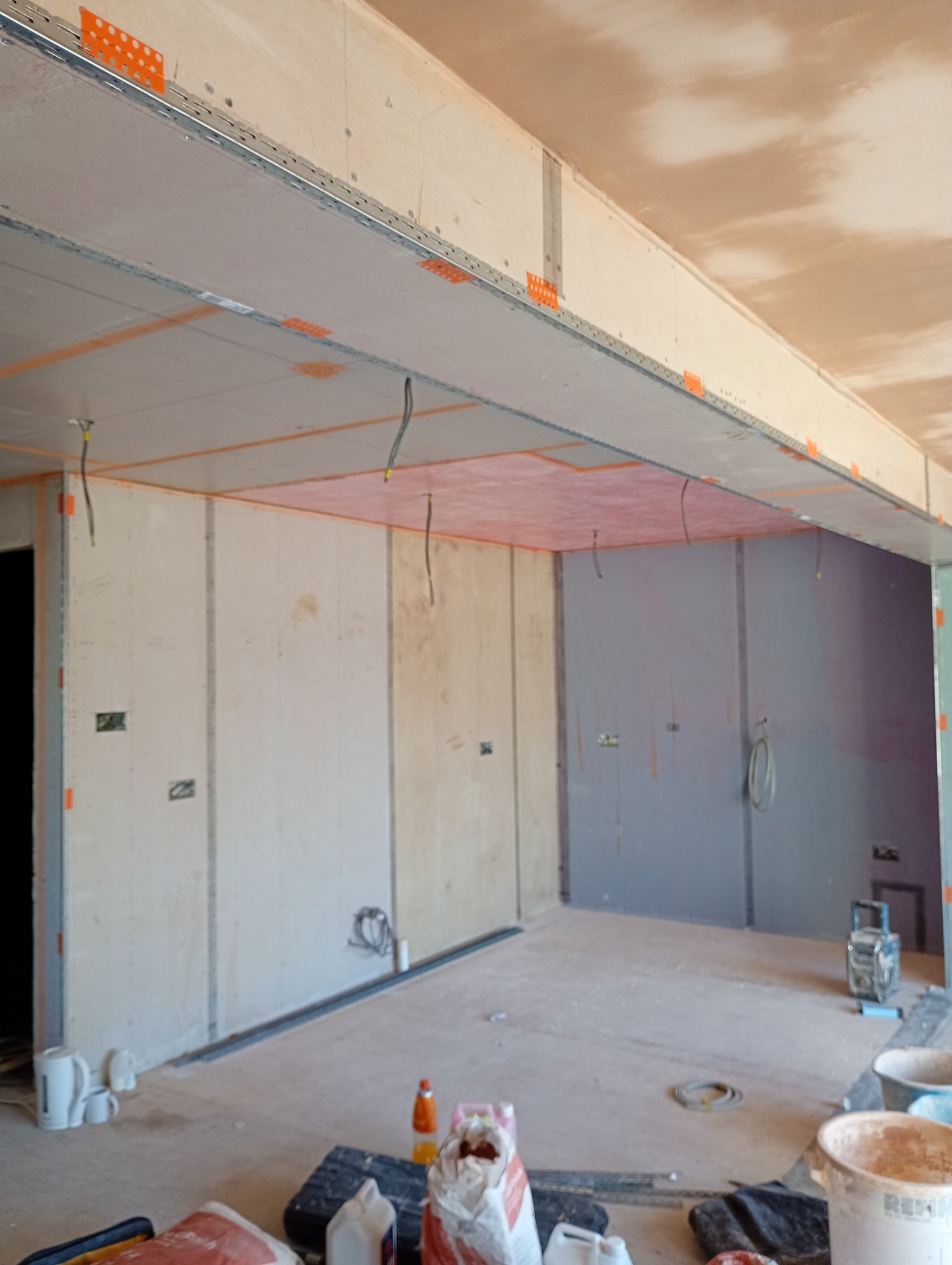 Dusty plasterboard walls and ceiling before skimming in Whitstable