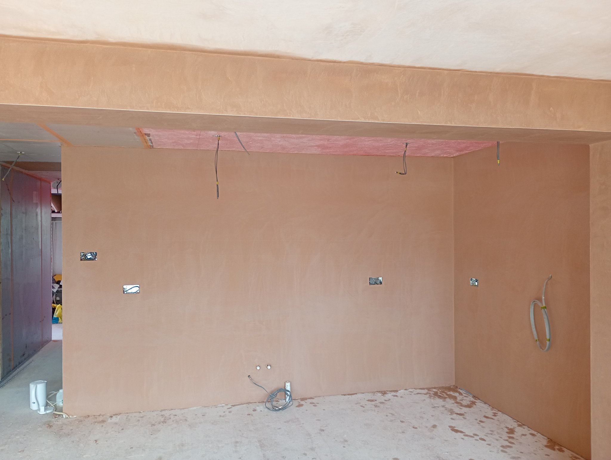 Freshly skimmed wall and ceiling in an open plan kitchen and diner in Whitstable